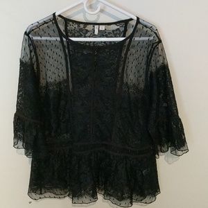 New dressy overlay top with lace and ruffles.